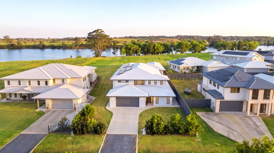 Aerial view of the home, garage and surrounding neighbourhood