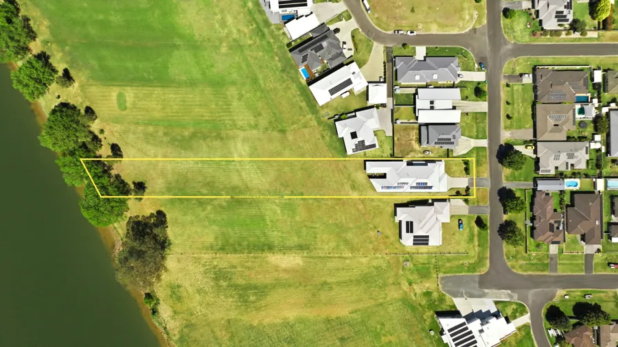 Overhead photograph of the home and its river setting