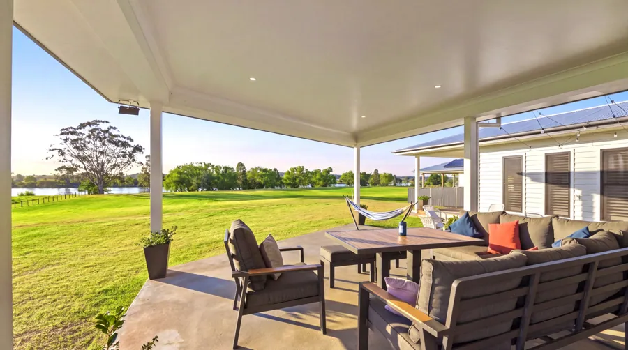 Covered outdoor living looking across the lawn