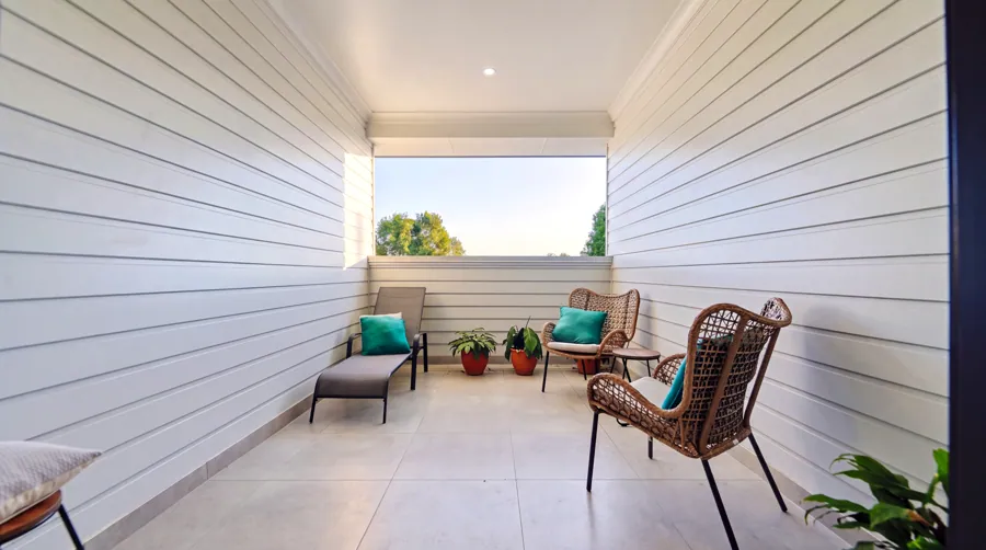 A sheltered balcony sitting area