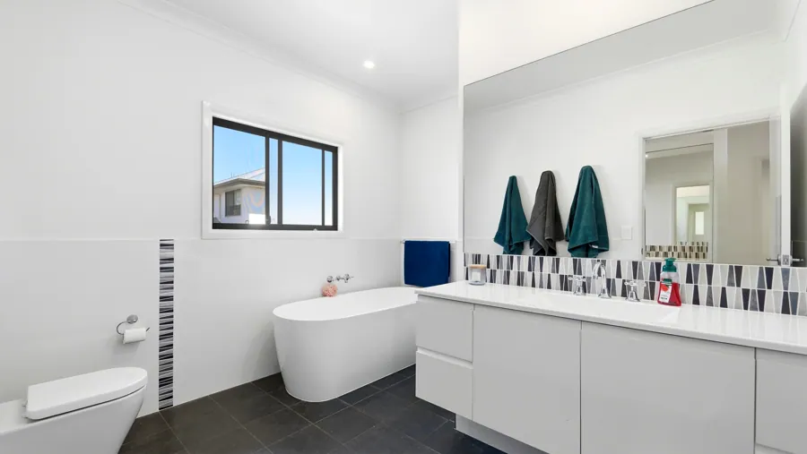 Bathroom with a freestanding bath and long vanity