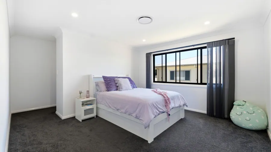 A light bedroom with built-in storage