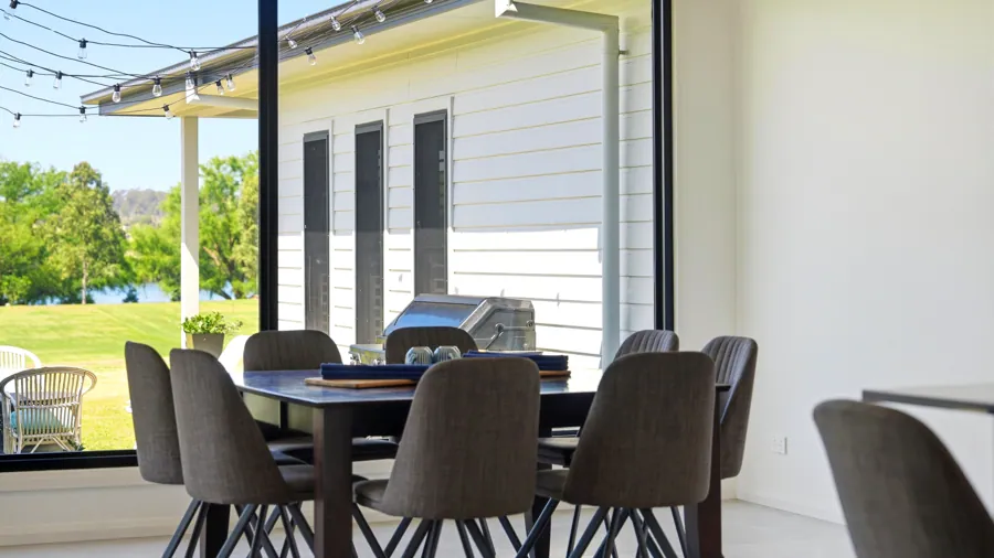Dining table beside the covered outdoor area