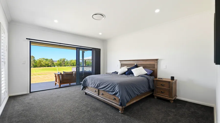 Bedroom opening to the lawn and covered outdoor area