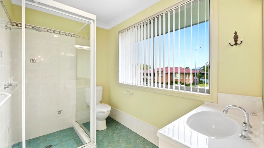 Bathroom with a bath, shower and wide window