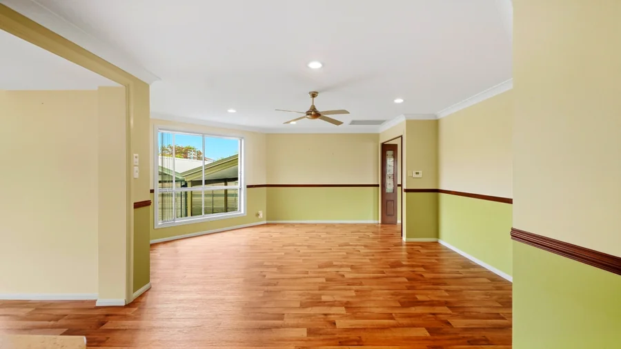 Dining space with a ceiling fan and garden outlook