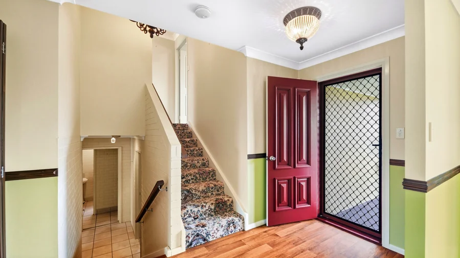 Front entrance with stairs to the upper level