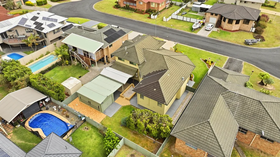 Aerial view of the home and detached garage