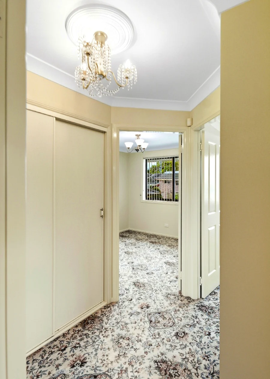 Hallway with decorative ceiling detail