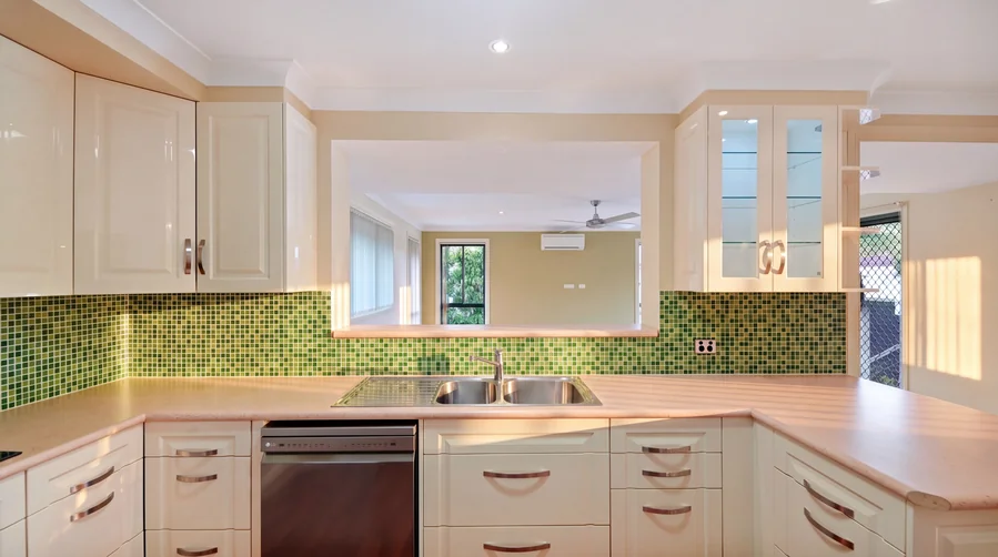 Kitchen sink and bench beneath the interior opening