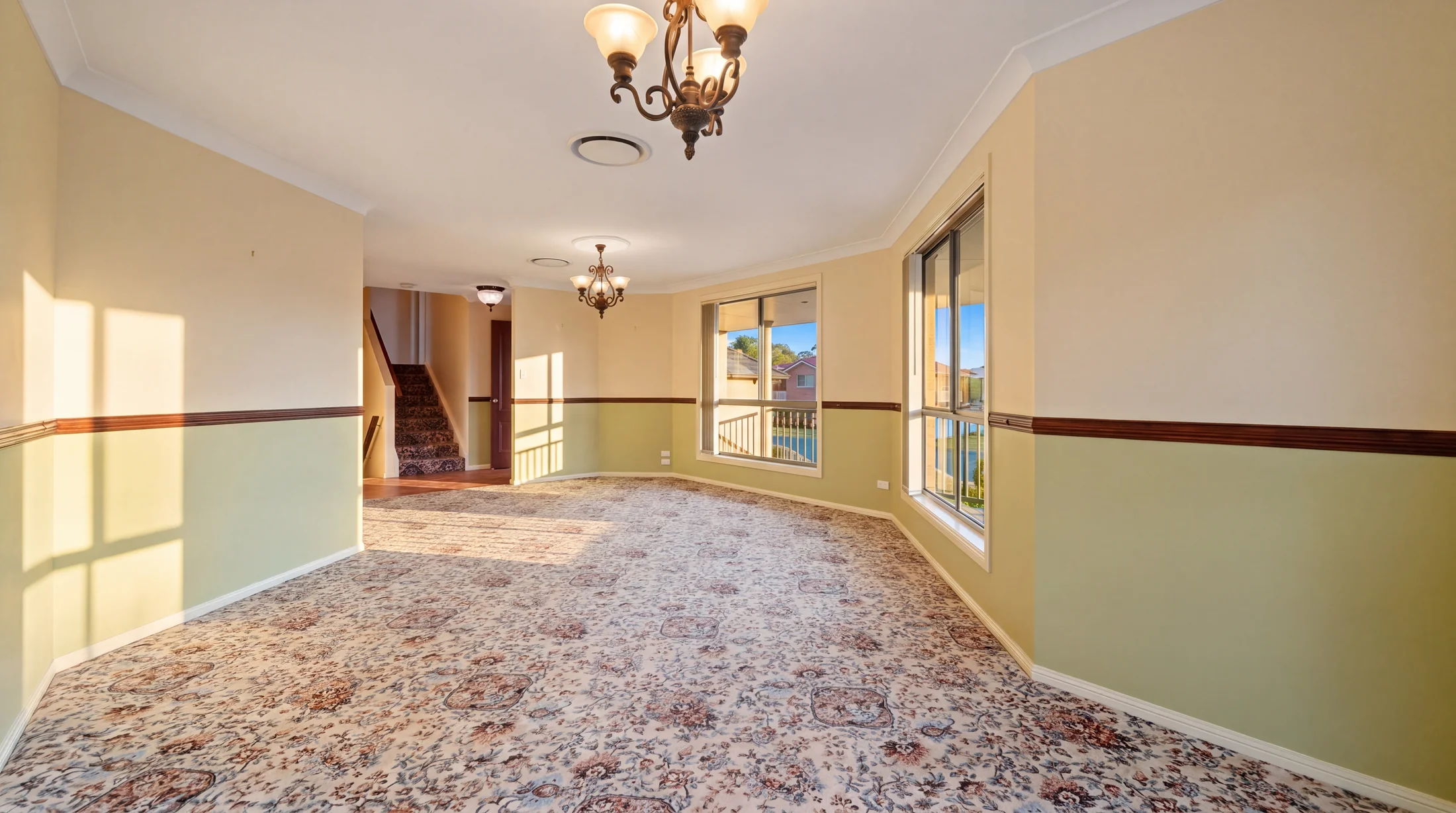 Carpeted lounge with windows to the front garden